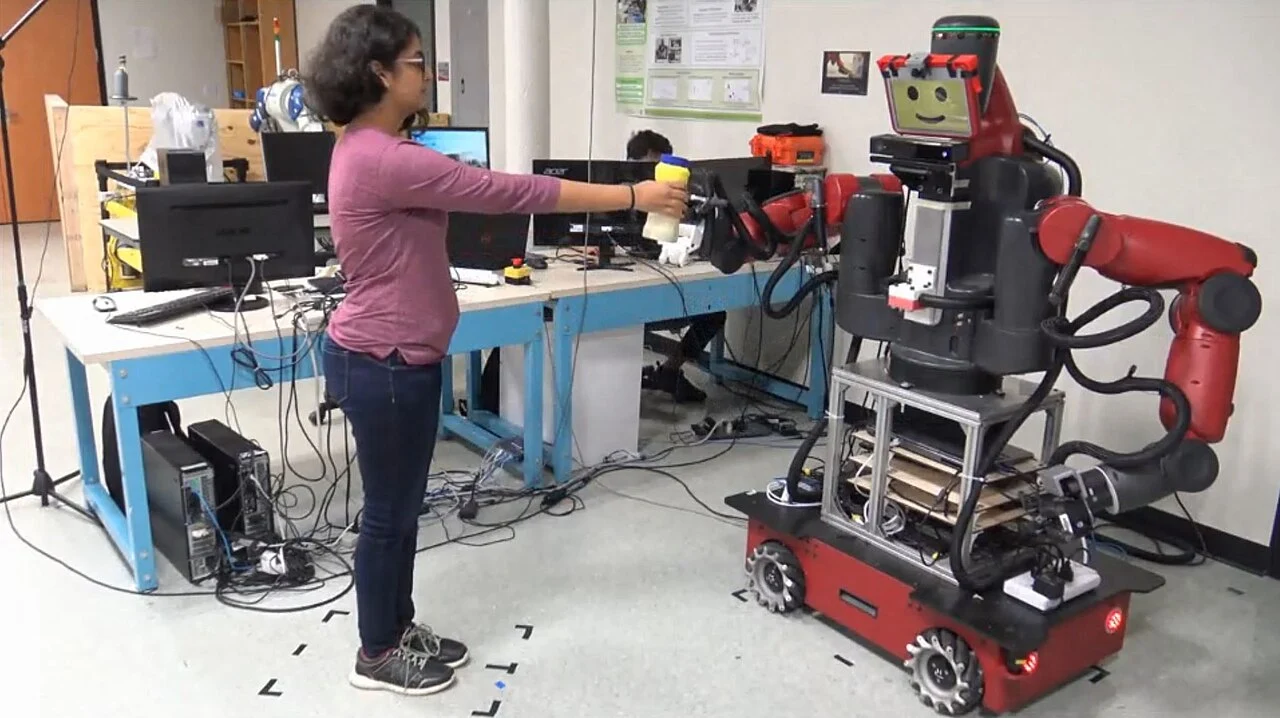 A Baxter robot learning an object handover from a human demonstration